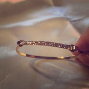 Gold light weight bracelet.